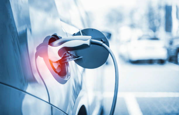 Electric Car Charging At Power Station